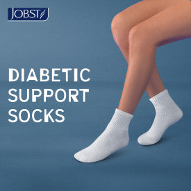 Person wearing white diabetic support socks with JOBST logo and text on a blue background

Details