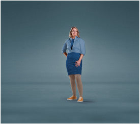 Woman wearing a blue denim outfit on a gray background