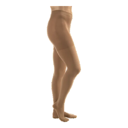 Beige tights worn by a person on a white background