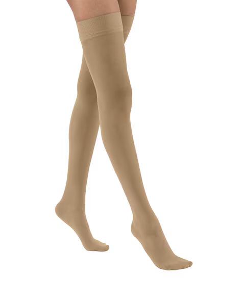Jobst UltraSheer 8-15 mmHg Thigh High Closed Toe Compression Socks worn by a person