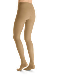 Beige tights worn by a person on a white background