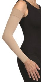 Beige arm sleeve worn by a person in a black sleeveless top from Compressionsale on a white background.