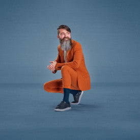 Man in an orange coat posing on a blue background