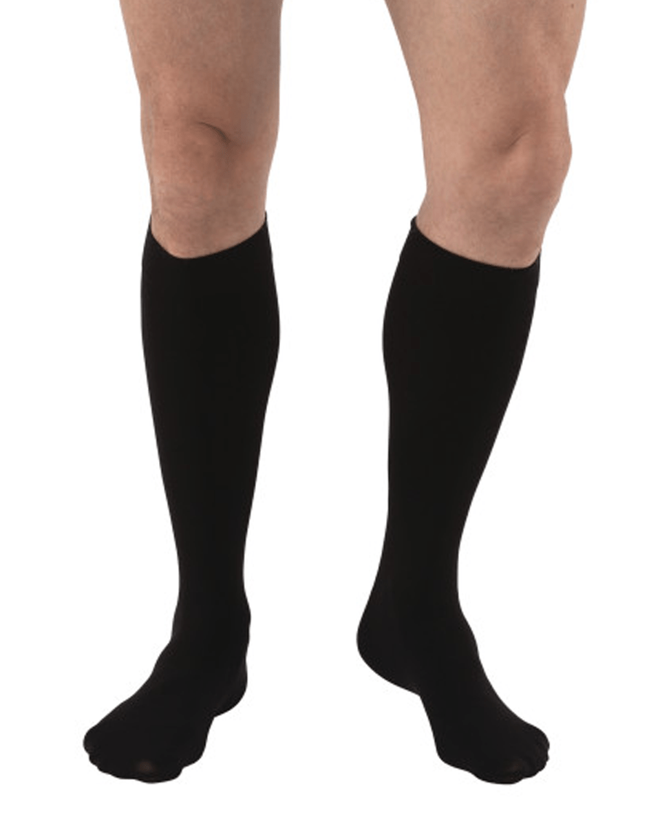 Knee-high compression stockings in beige and black for venous care