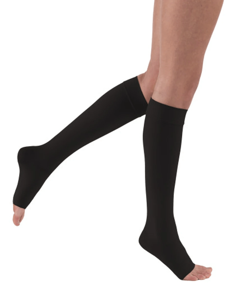 Jobst Relief Black knee-high compression stockings with open toe (20-30 mmHg) worn by a person