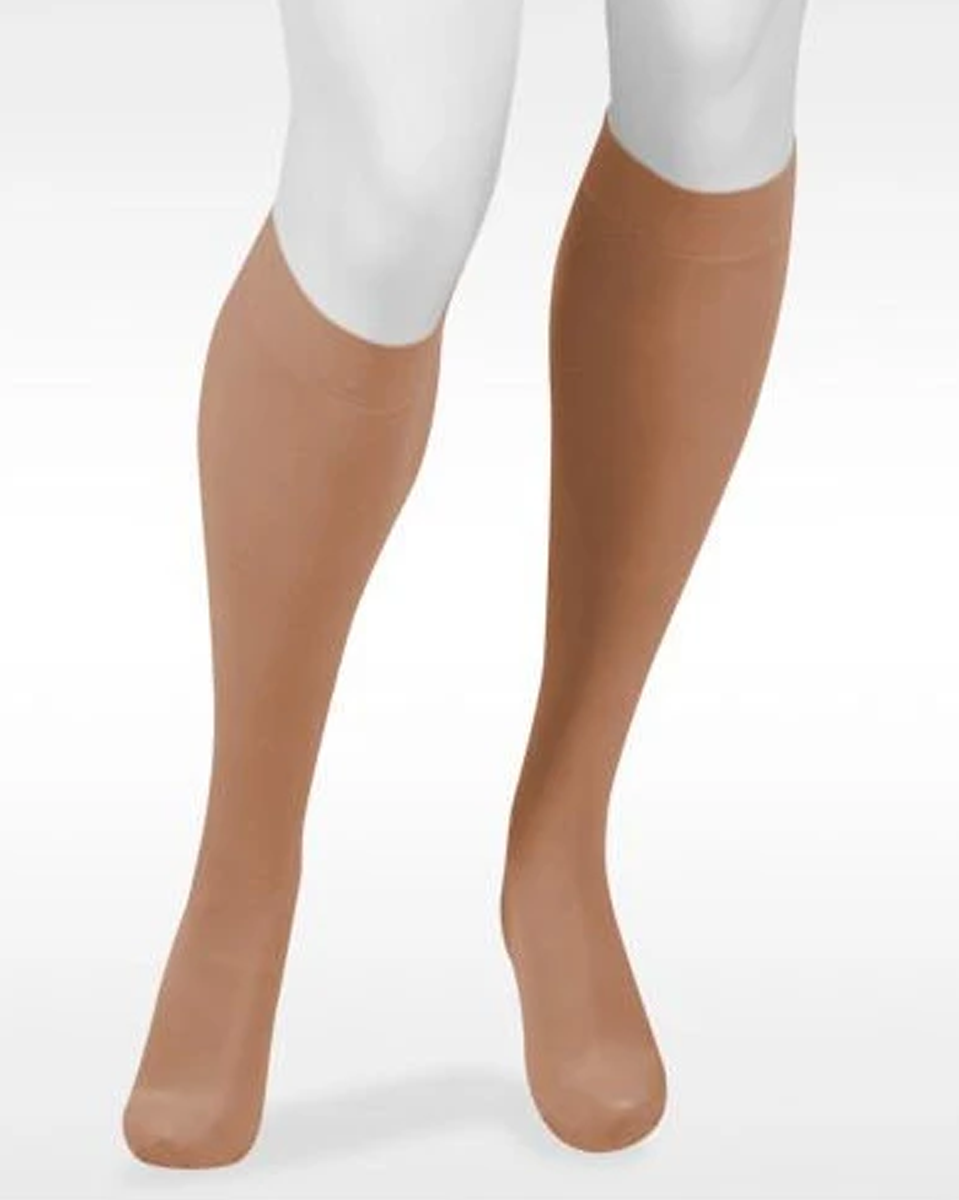 Juzo Assist 30-40 mmHg Knee High  compression (30-40 mmHg) worn by a person